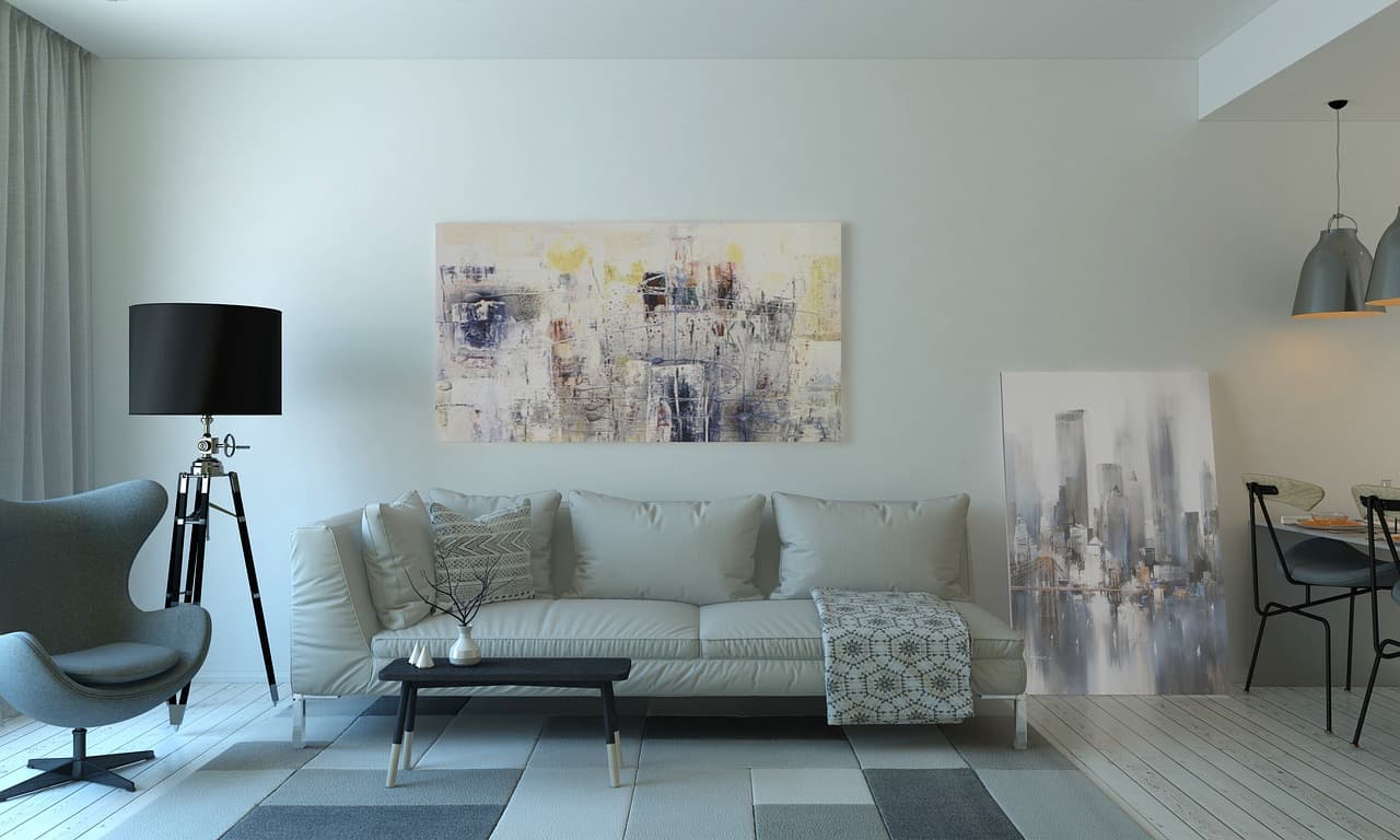 Interior living room of the Holden Beach Residence, with neutral modern furnishings and oak flooring